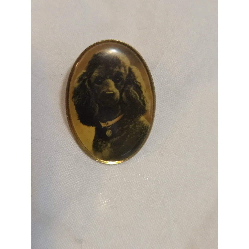 vintage Otter House lapel pin featuring a portrait of a black poodle